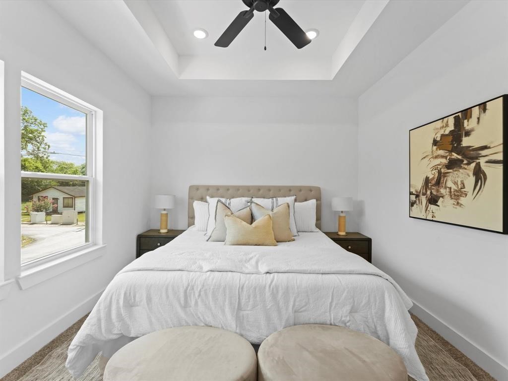 1448 Dewalt Street Houston, TX 77088 - Photo 12 of 24 a bedroom with a bed and window