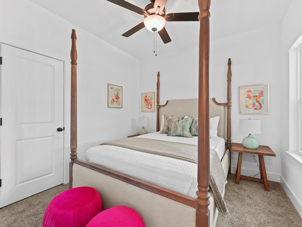1448 Dewalt Street Houston, TX 77088 - Photo 14 of 24 a bedroom with a bed and a chandelier