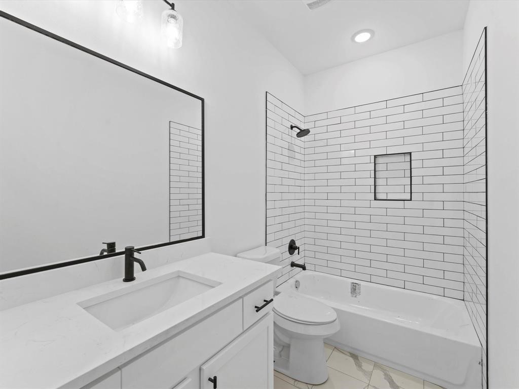 1448 Dewalt Street Houston, TX 77088 - Photo 16 of 24 a bathroom with a sink a toilet and shower