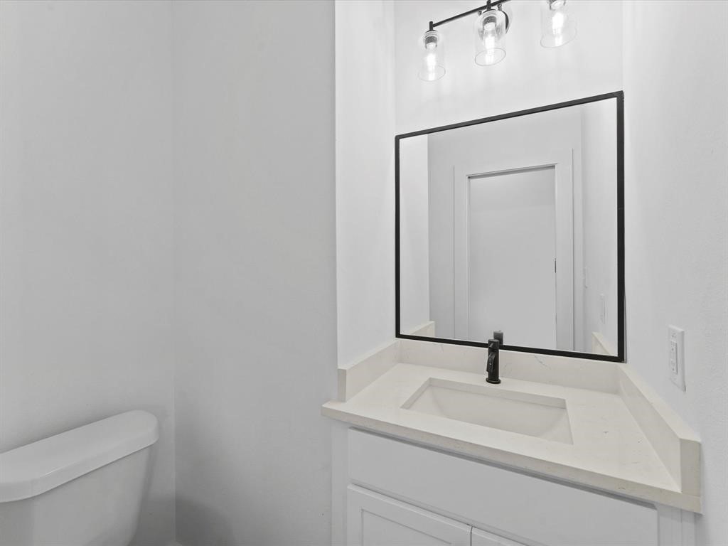 1448 Dewalt Street Houston, TX 77088 - Photo 17 of 24 a bathroom with a sink and a toilet