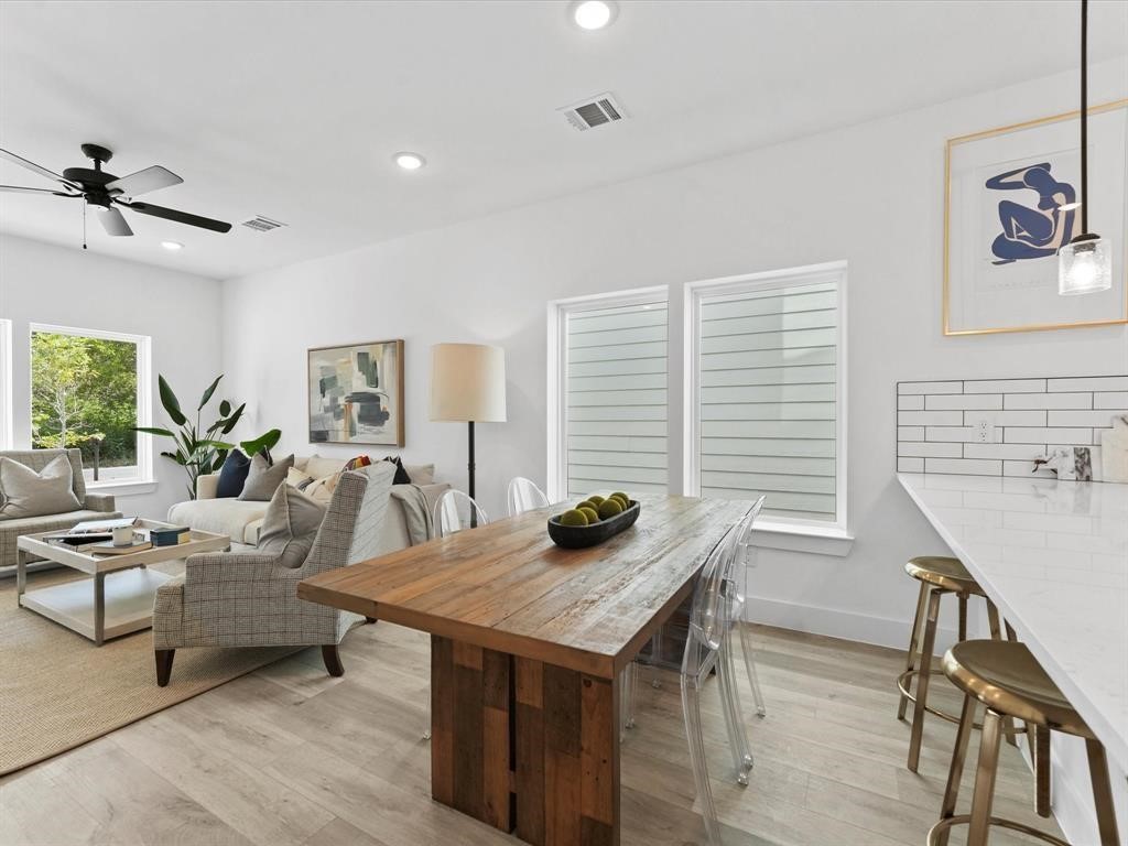 1448 Dewalt Street Houston, TX 77088 - Photo 20 of 24 a view of a dining room with furniture window and wooden floor