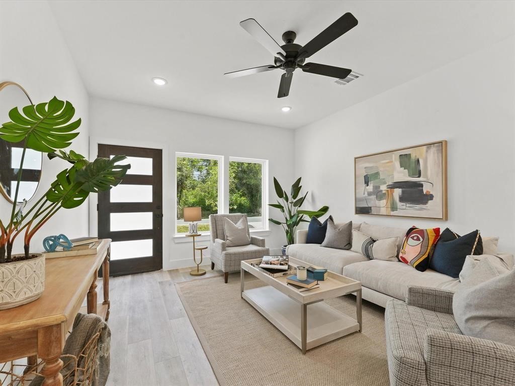 1448 Dewalt Street Houston, TX 77088 - Photo 3 of 24 a living room with furniture and a large window