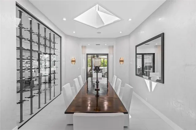 a kitchen with a table chairs stove and cabinets