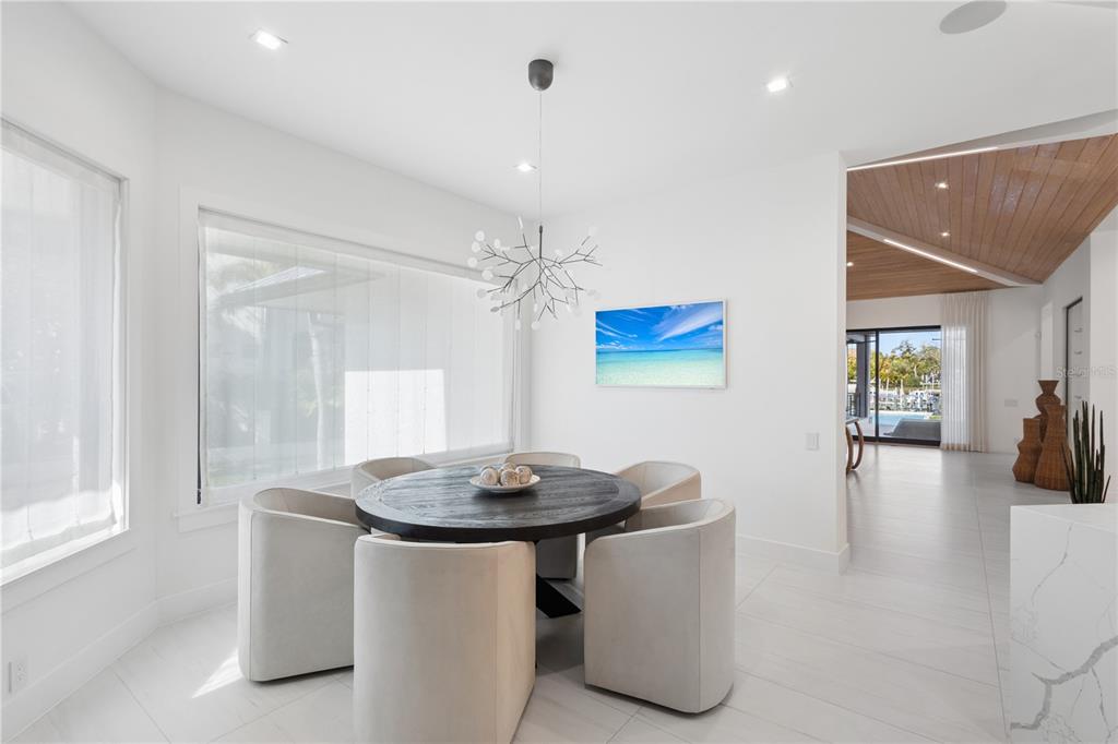 1808 Flower Drive Sarasota, FL 34239 - Photo 15 of 56 a dining room with table and chairs