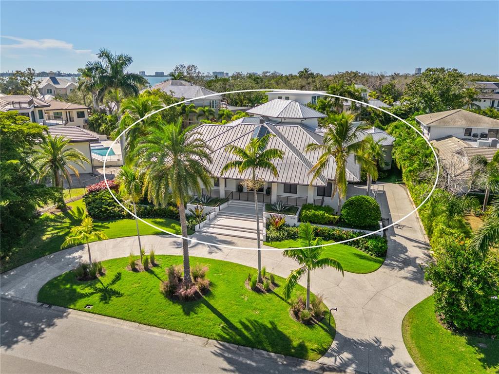 1808 Flower Drive Sarasota, FL 34239 - Photo 2 of 56 an aerial view of a house with a garden and trees