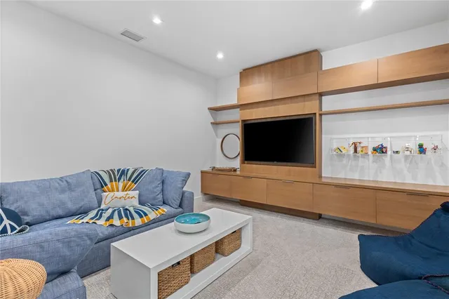 a bedroom with a bed and a ceiling fan