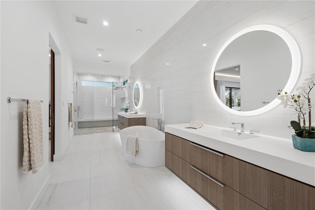 1808 Flower Drive Sarasota, FL 34239 - Photo 26 of 56 a bathroom with a double vanity sink mirror and shower