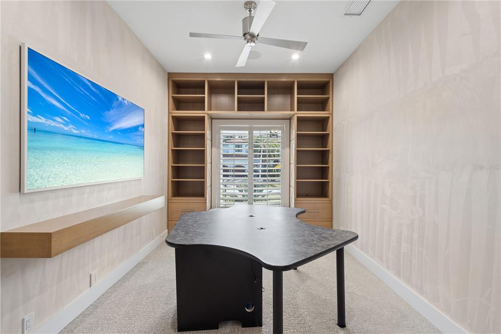 1808 Flower Drive Sarasota, FL 34239 - Photo 33 of 56 a view of a hallway with a kitchen and chandelier