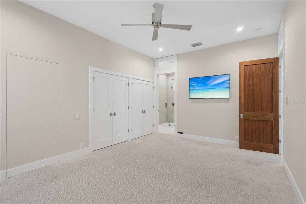 1808 Flower Drive Sarasota, FL 34239 - Photo 35 of 56 a view of an empty room with a ceiling fan