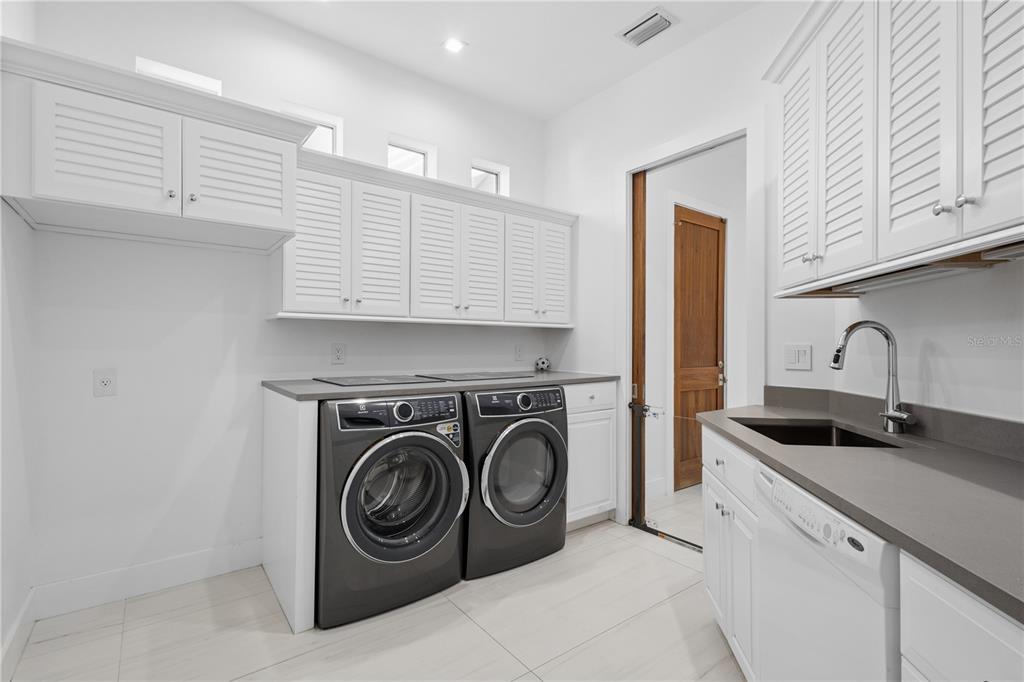 1808 Flower Drive Sarasota, FL 34239 - Photo 41 of 56 a utility room with sink dryer and washer