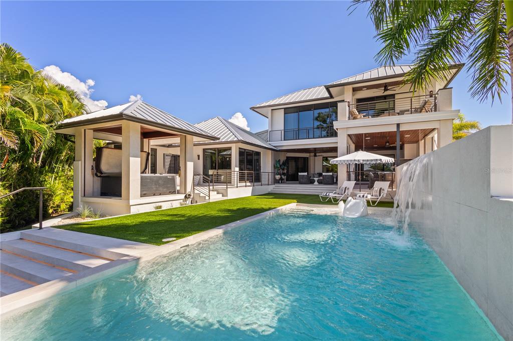1808 Flower Drive Sarasota, FL 34239 - Photo 46 of 56 a view of a house with swimming pool and porch