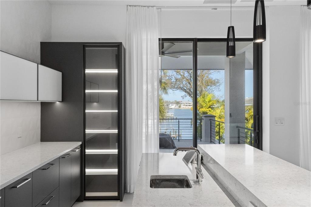 1808 Flower Drive Sarasota, FL 34239 - Photo 47 of 56 a kitchen with a refrigerator and a sink