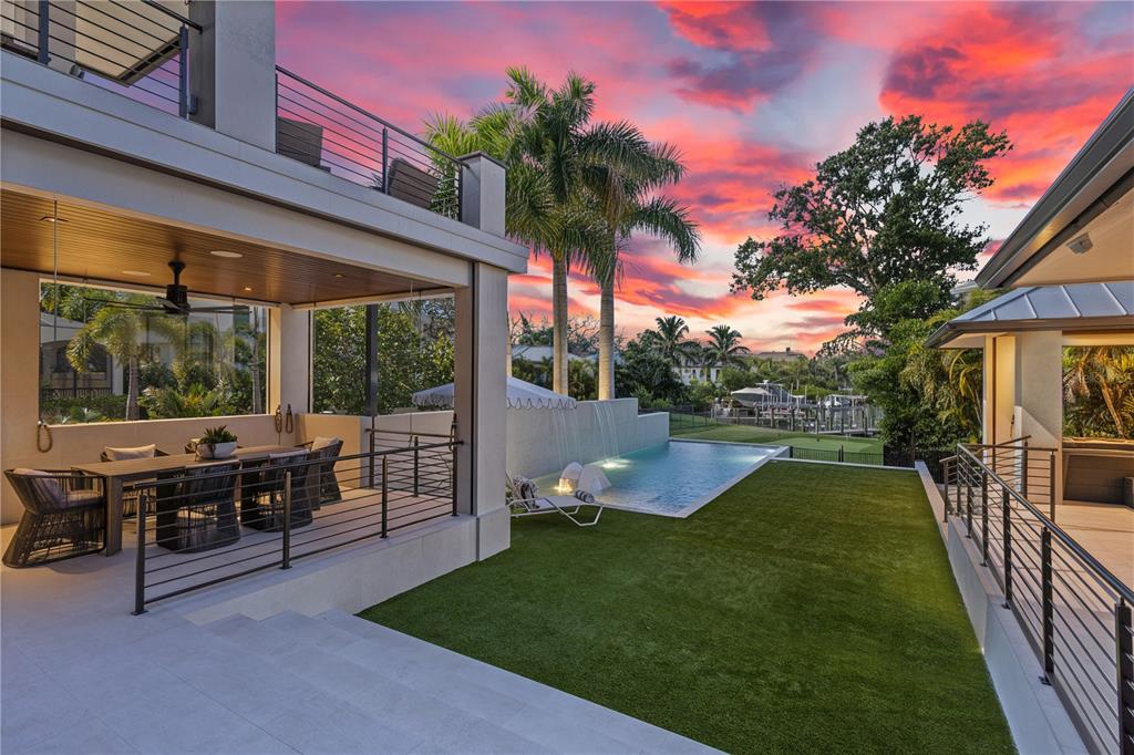 1808 Flower Drive Sarasota, FL 34239 - Photo 51 of 56 a view of a patio with chairs and a backyard