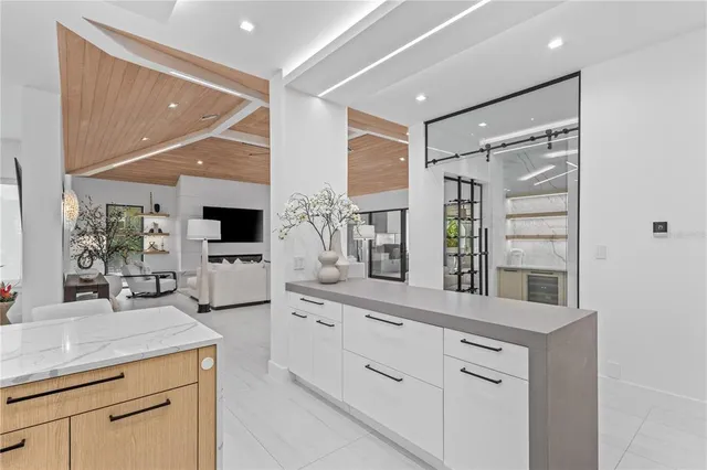 a kitchen with counter top space and cabinets