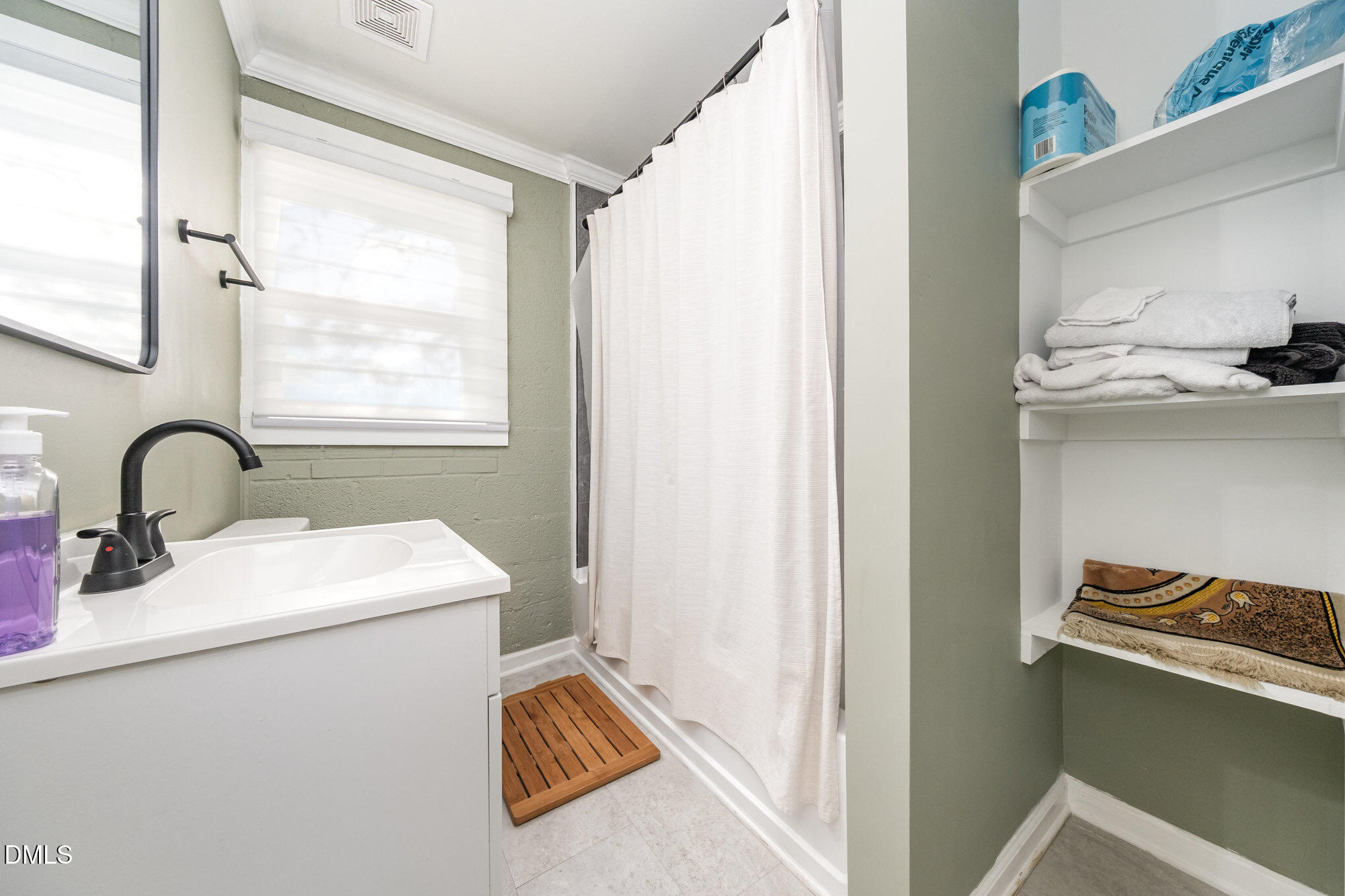740 Quarry Street Raleigh, NC 27601 - Photo 16 of 29 a view of bathroom with a sink and mirror