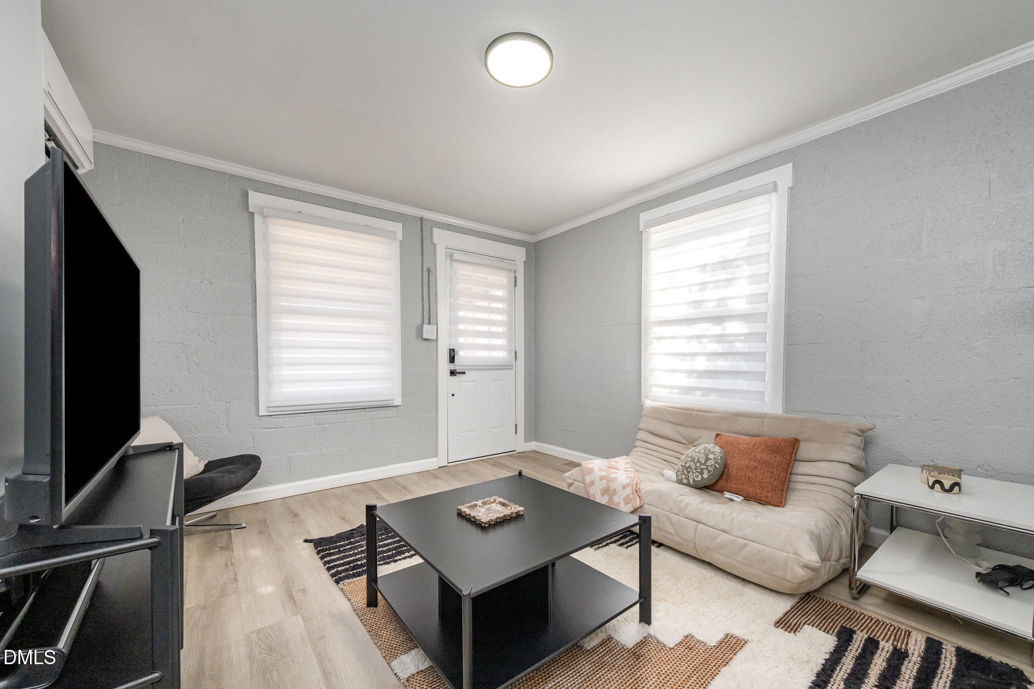 740 Quarry Street Raleigh, NC 27601 - Photo 18 of 29 a living room with furniture and a flat screen tv