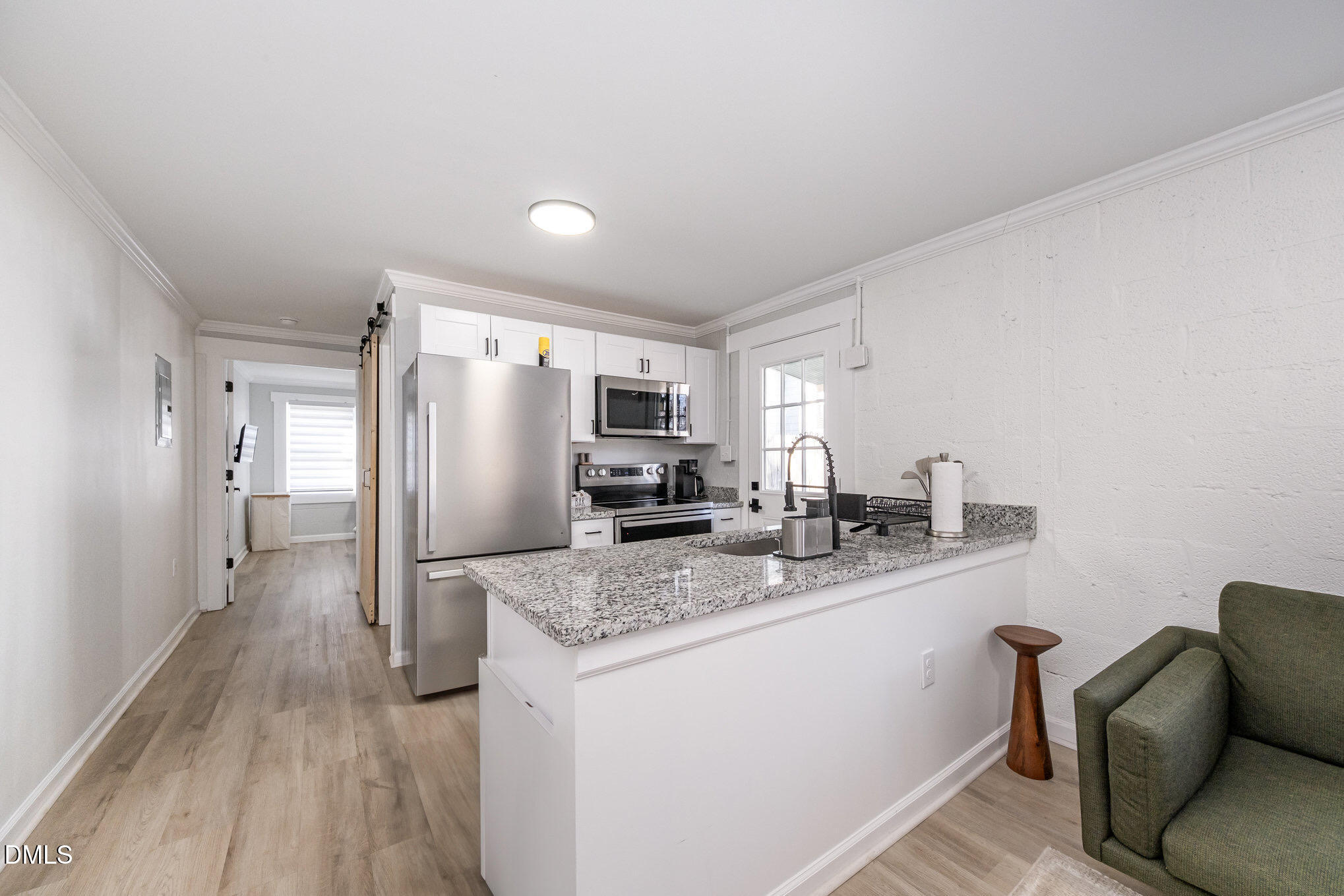 740 Quarry Street Raleigh, NC 27601 - Photo 8 of 29 a kitchen with stainless steel appliances granite countertop a sink stove and refrigerator