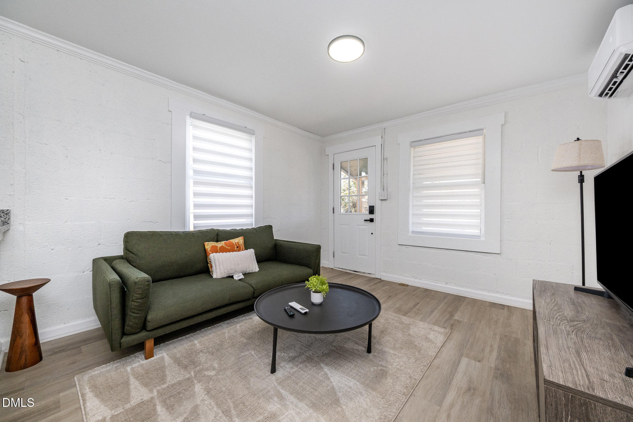 740 Quarry Street Raleigh, NC 27601 - Photo 9 of 29 a living room with furniture and a window