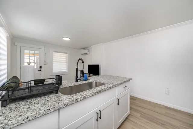 a kitchen with granite countertop a sink and a granite counter tops