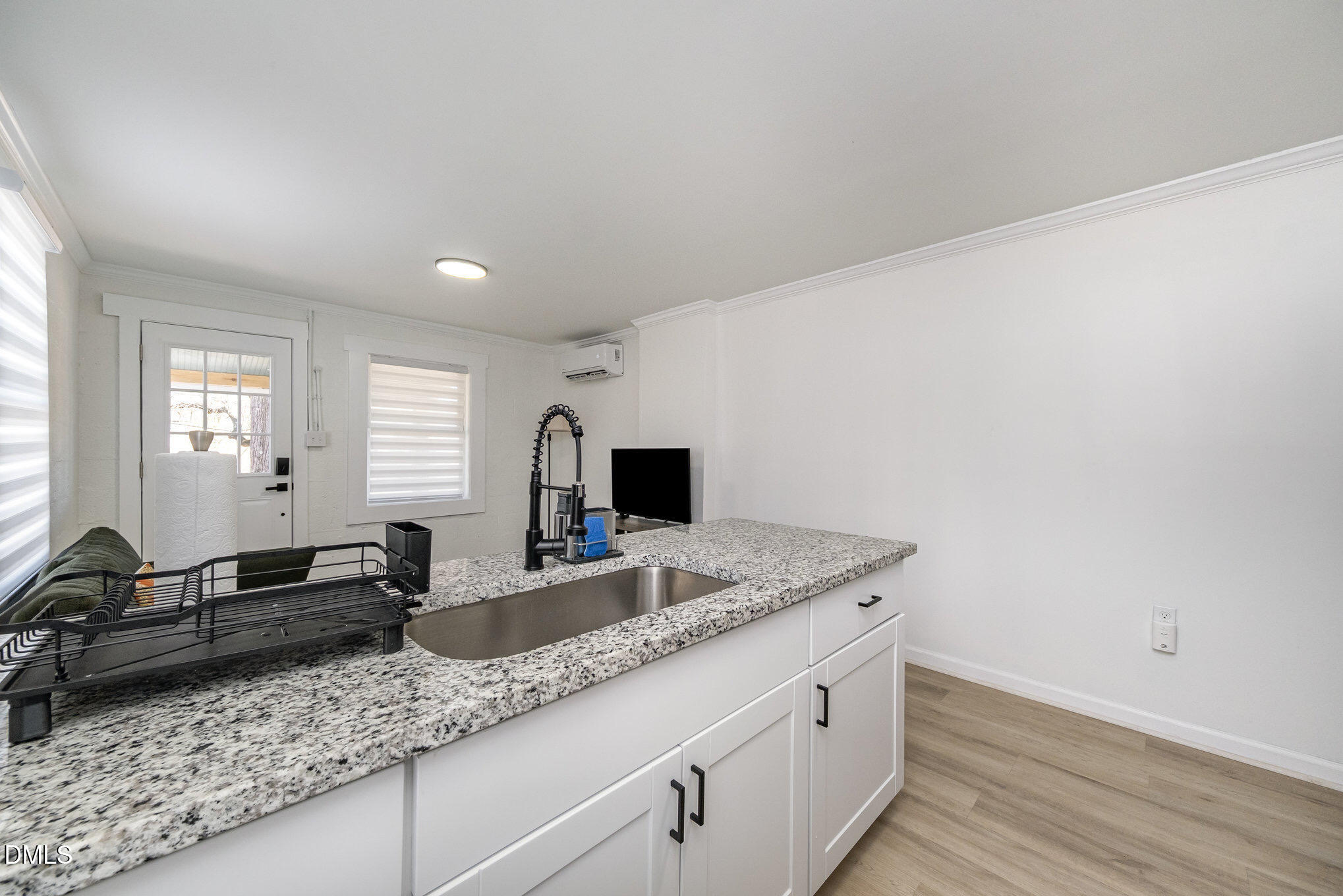 740 Quarry Street Raleigh, NC 27601 - Photo 10 of 29 a kitchen with granite countertop a sink and a granite counter tops