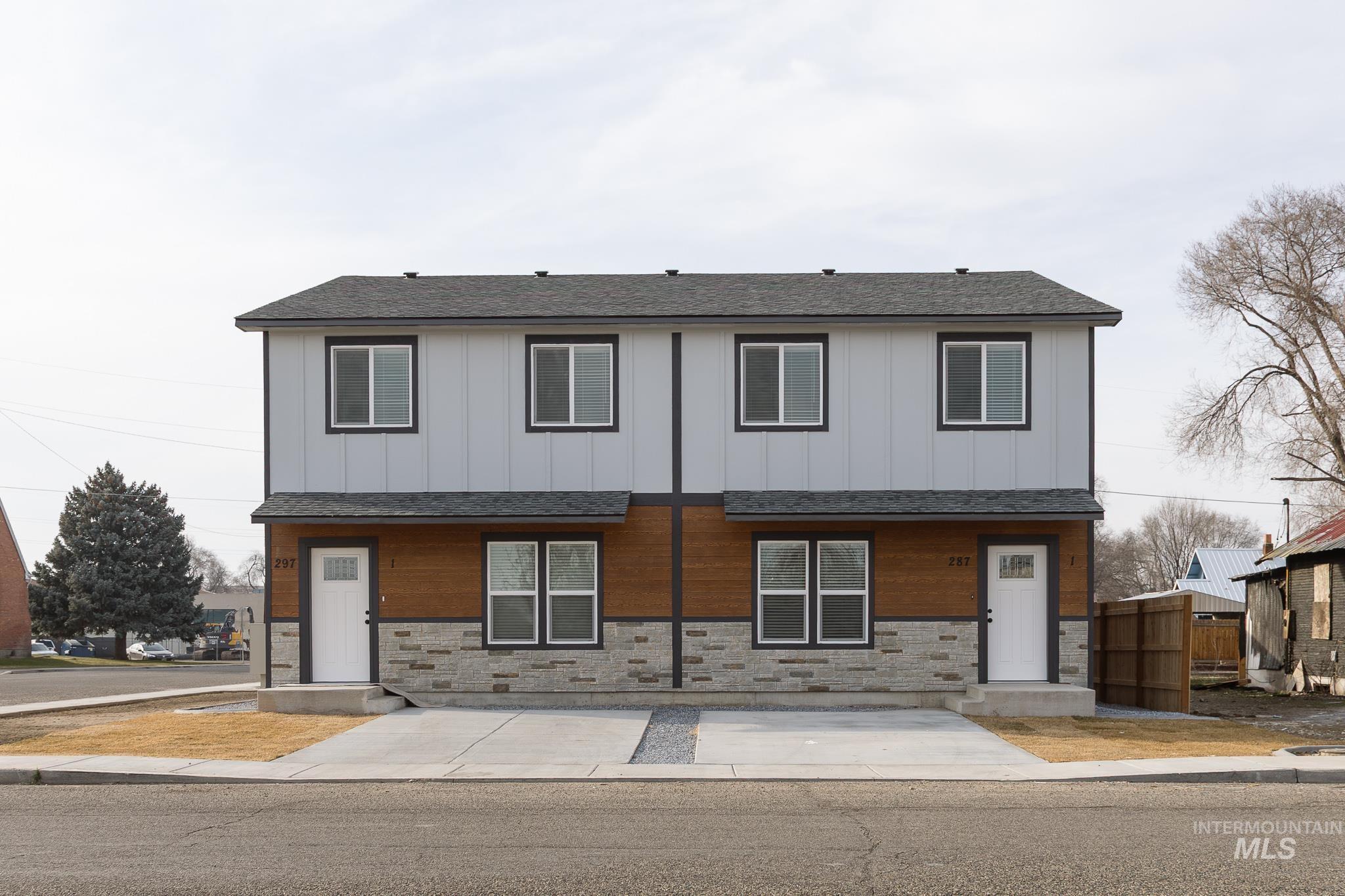 297 Southwest 6th Street, Unit 2 Ontario, OR 97914 - Photo 34 of 37 View of front of house with stone siding, a shingled roof, and board and batten siding