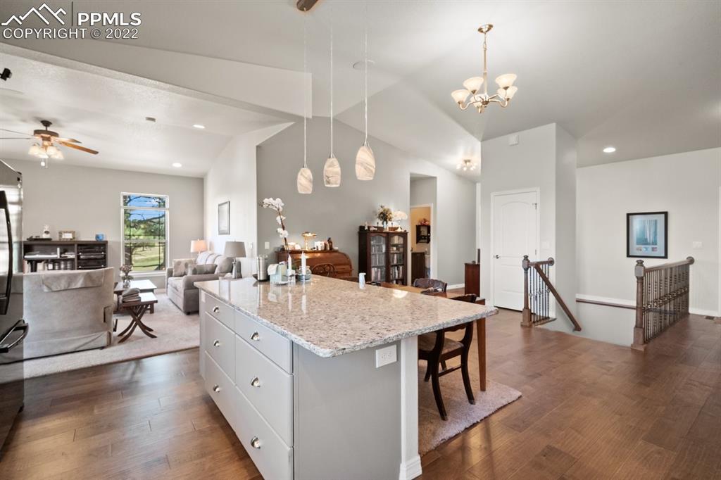 20765 Warriors Path Drive Peyton, CO 80831 - Photo 13 of 50 a large kitchen with a table and chairs