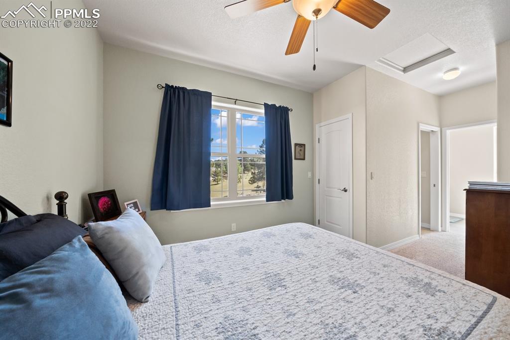 20765 Warriors Path Drive Peyton, CO 80831 - Photo 15 of 50 a bedroom with a bed and a dresser