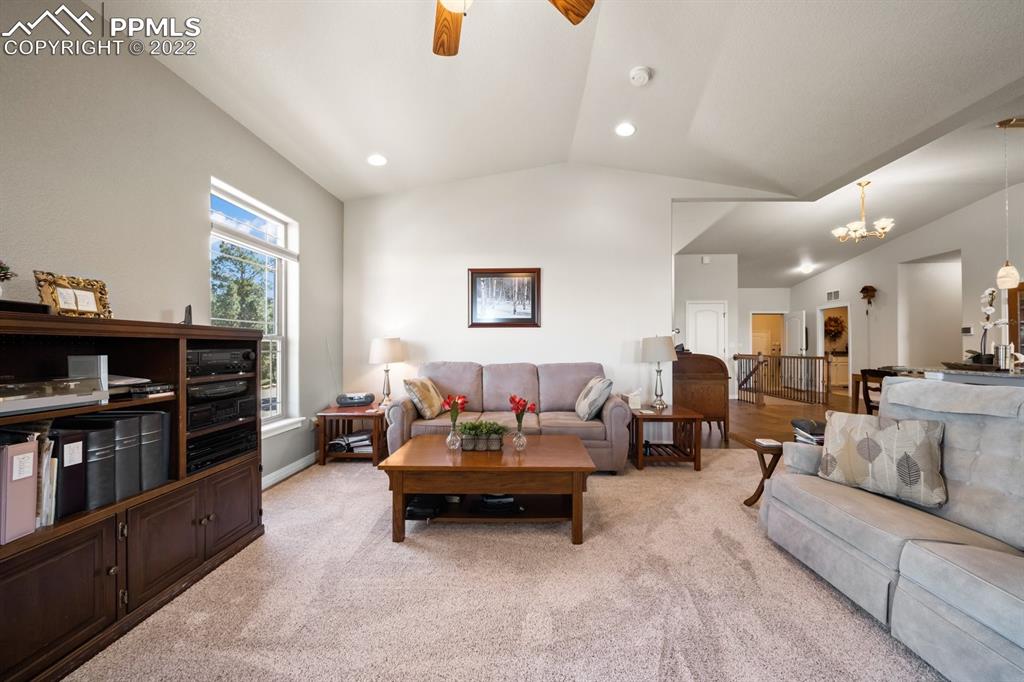 20765 Warriors Path Drive Peyton, CO 80831 - Photo 20 of 50 a living room with furniture and a flat screen tv