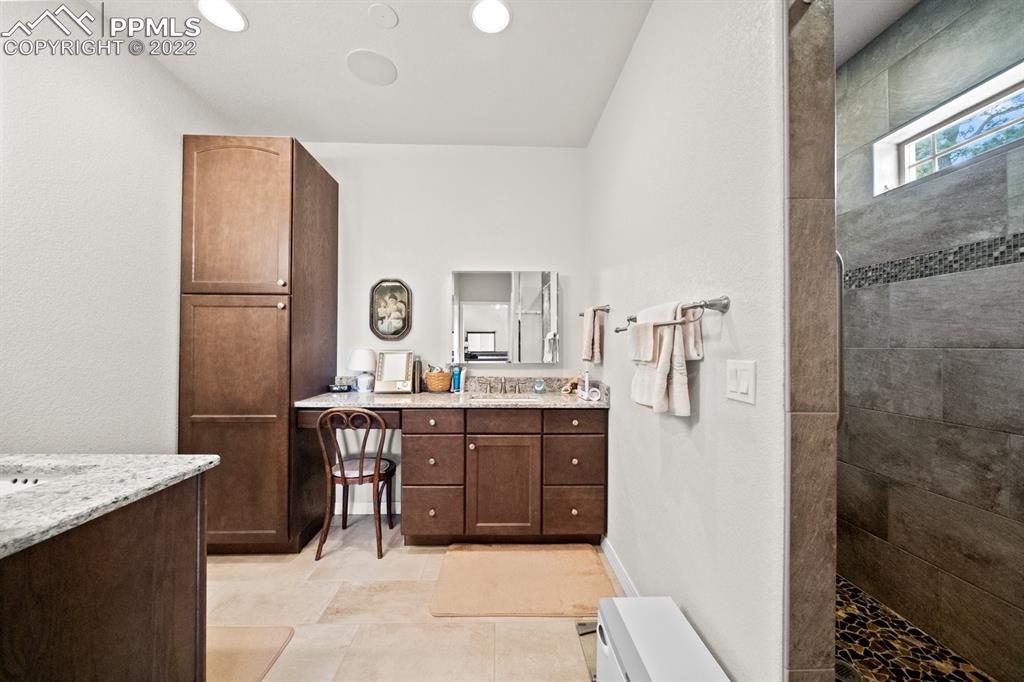 20765 Warriors Path Drive Peyton, CO 80831 - Photo 27 of 50 a room with a table and chairs