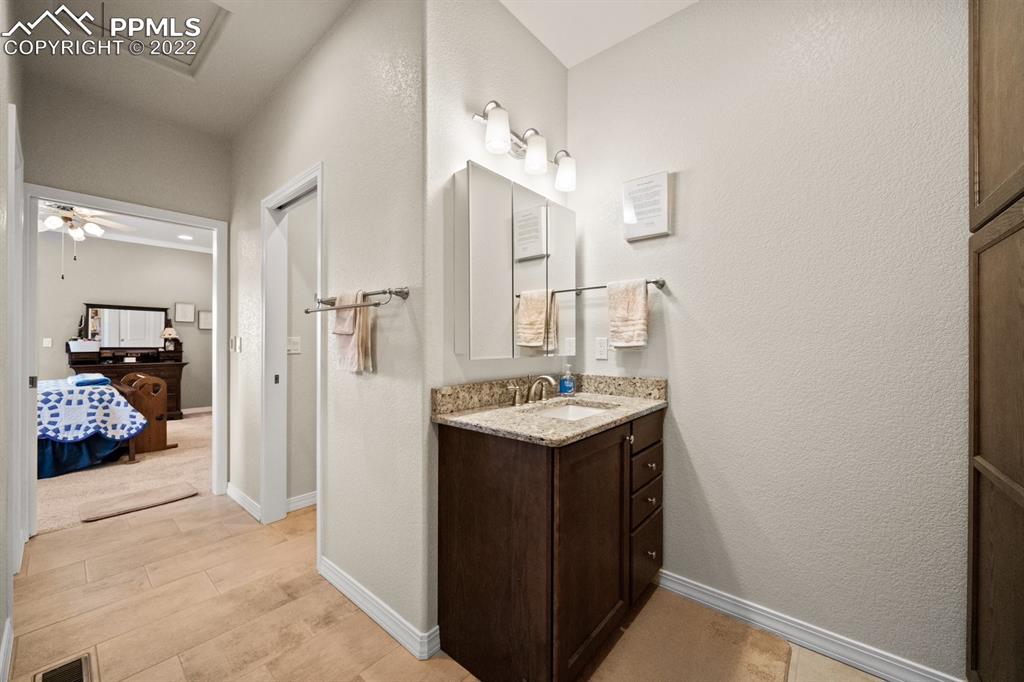 20765 Warriors Path Drive Peyton, CO 80831 - Photo 29 of 50 a kitchen with a sink stove and refrigerator