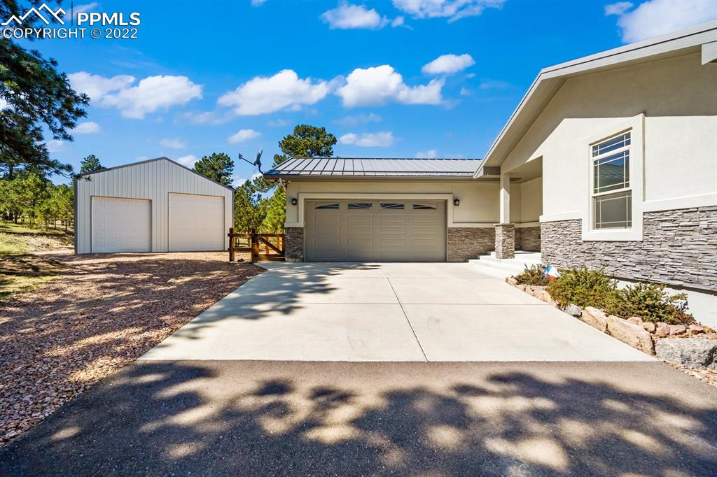 20765 Warriors Path Drive Peyton, CO 80831 - Photo 3 of 50 a view of a house with a yard