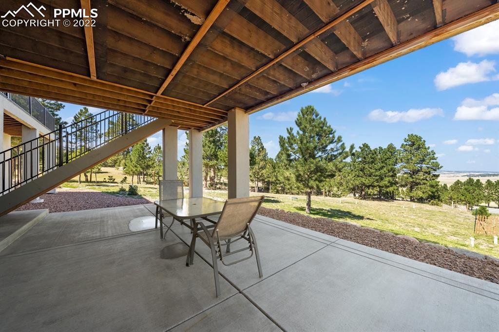 20765 Warriors Path Drive Peyton, CO 80831 - Photo 32 of 50 a building outdoor space with seating space
