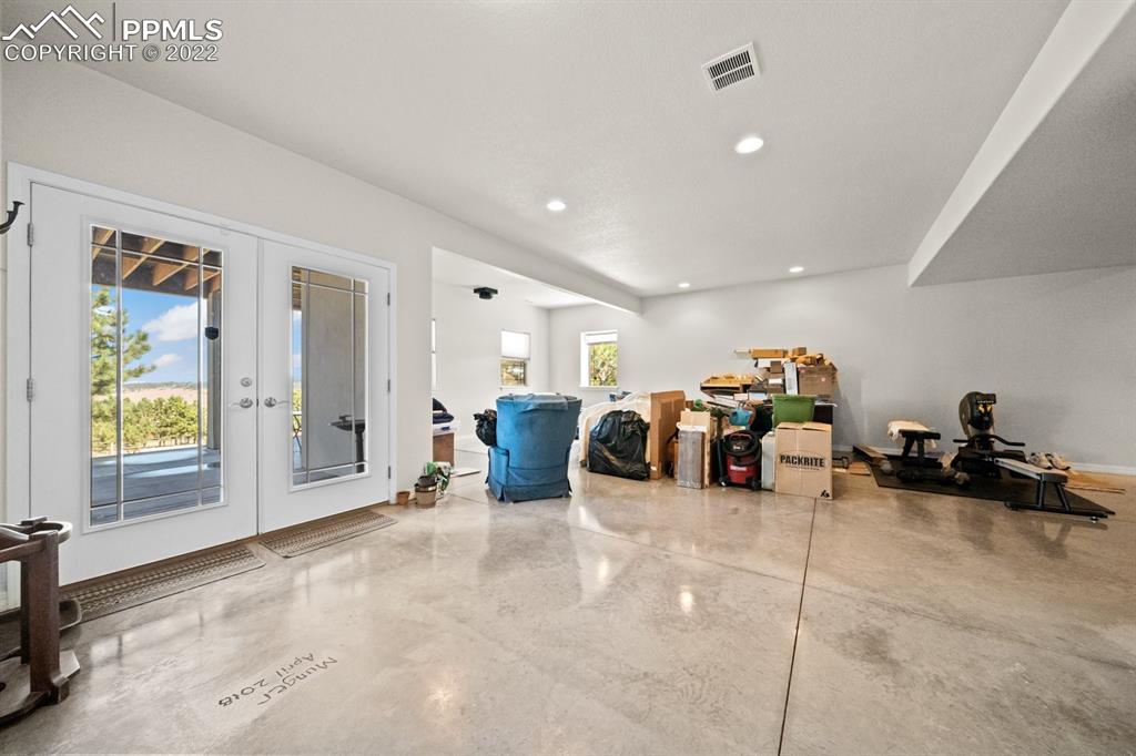 20765 Warriors Path Drive Peyton, CO 80831 - Photo 35 of 50 a large room with lots of gym equipment