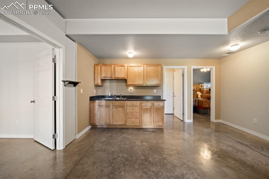 20765 Warriors Path Drive Peyton, CO 80831 - Photo 38 of 50 a view of kitchen with refrigerator and window