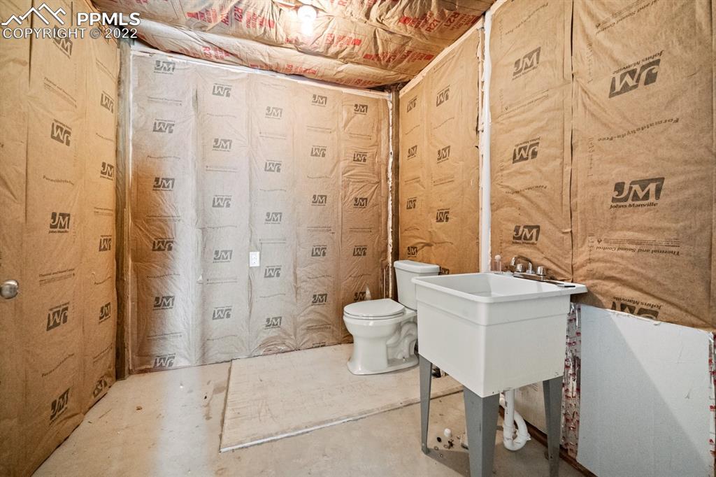 20765 Warriors Path Drive Peyton, CO 80831 - Photo 7 of 50 a spacious bathroom with a bathtub shower sink and toilet