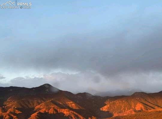 2913 Mesa Road, Unit A Colorado Springs, CO 80904 - Photo 15 of 15 a view of a yard in a cloudy sky