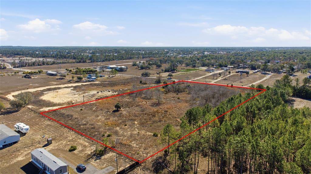 Sweet Gum Road Brooksville, FL 34613 - Photo 14 of 14 an aerial view of residential houses with outdoor space