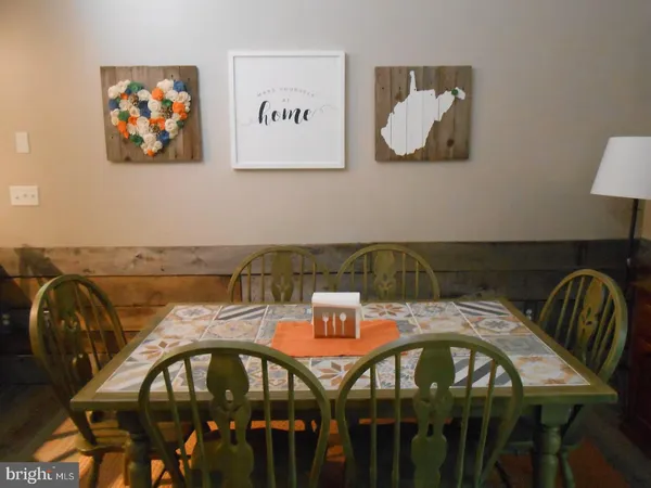 a view of a chairs and table in the kitchen