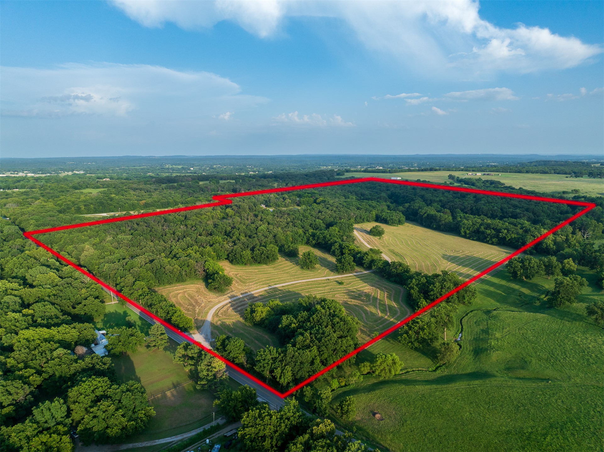 15291 East 400 Road Claremore, OK 74017 - Photo 70 of 96 Expansive acreage featuring mature woodlands, open fields, and a winding creek