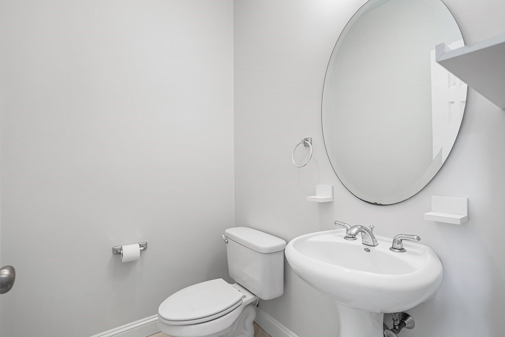 28 Brogden Road Ashland, MA 01721 - Photo 12 of 39 a bathroom with a sink a mirror and a toilet
