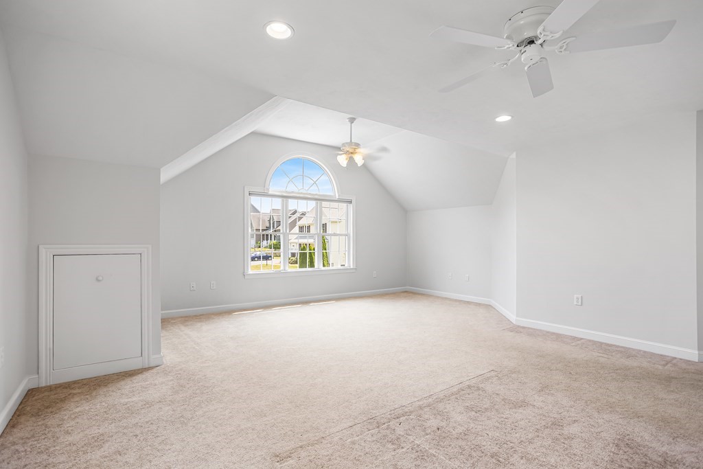 28 Brogden Road Ashland, MA 01721 - Photo 16 of 39 en empty room with windows and ceiling fan