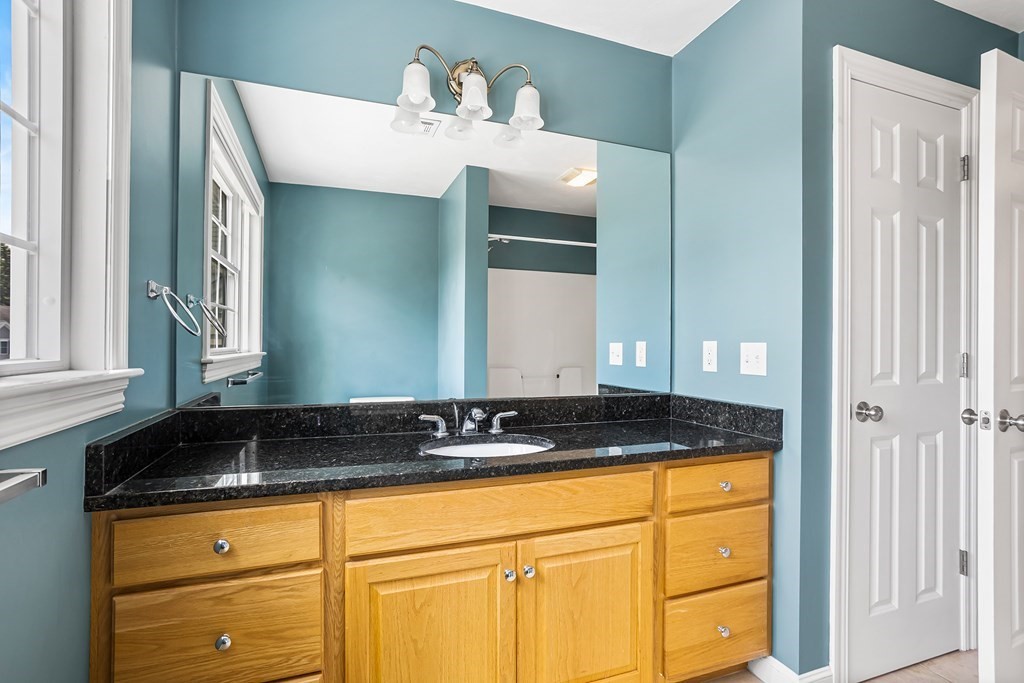 28 Brogden Road Ashland, MA 01721 - Photo 26 of 39 a bathroom with a sink and a mirror
