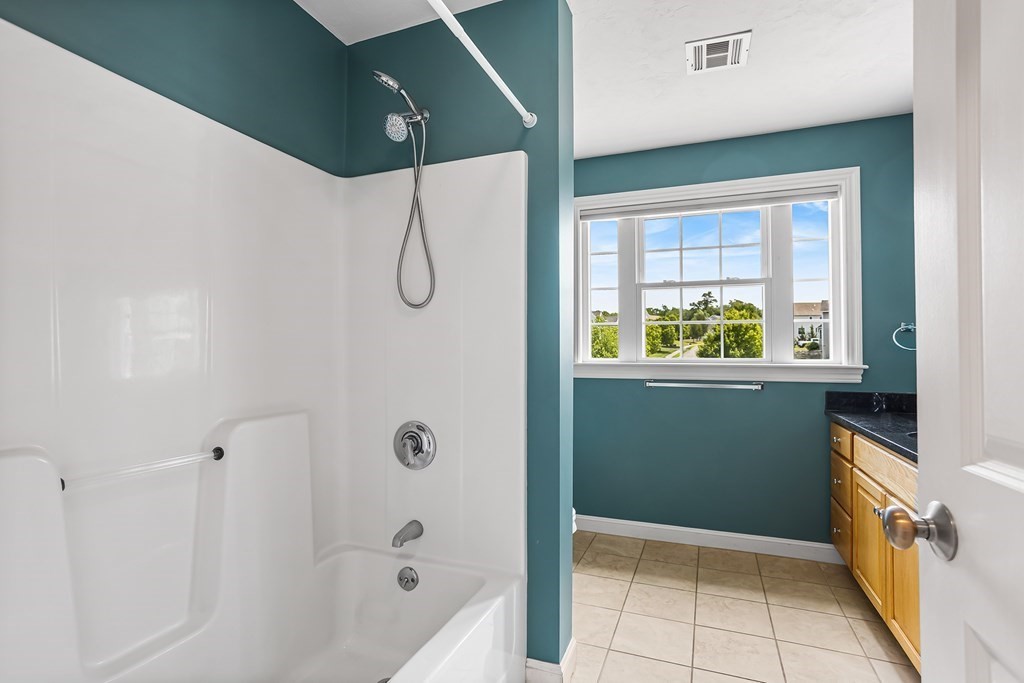 28 Brogden Road Ashland, MA 01721 - Photo 27 of 39 a bathroom with a bathtub and a shower