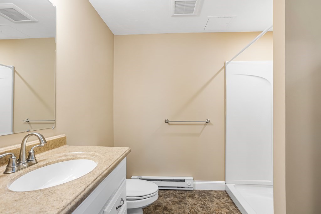 28 Brogden Road Ashland, MA 01721 - Photo 30 of 39 a bathroom with a granite countertop sink toilet and shower