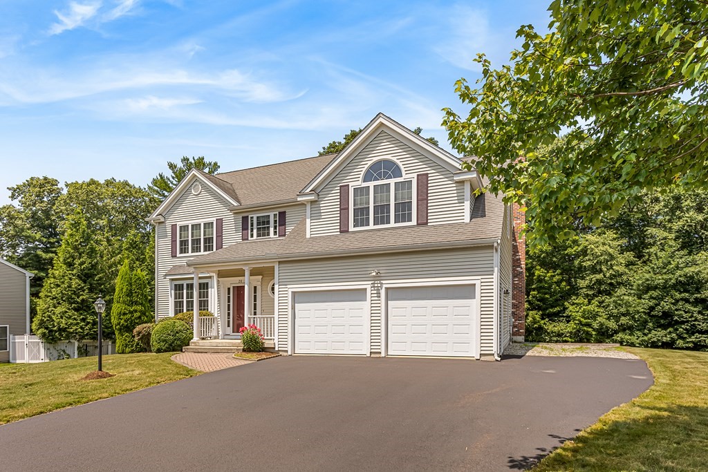 28 Brogden Road Ashland, MA 01721 - Photo 3 of 39 a front view of a house with a yard and garage