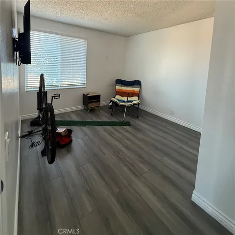 a bathroom with a toilet and a shower curtain
