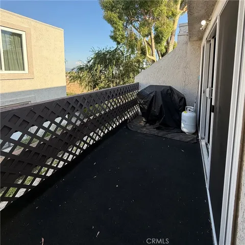 a kitchen with a refrigerator a stove a sink dishwasher and white cabinets with wooden floor