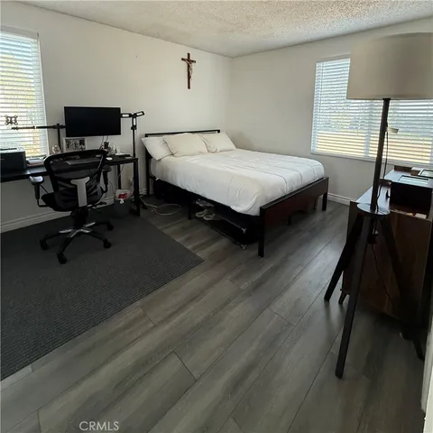 a bathroom with a double vanity sink toilet and mirror