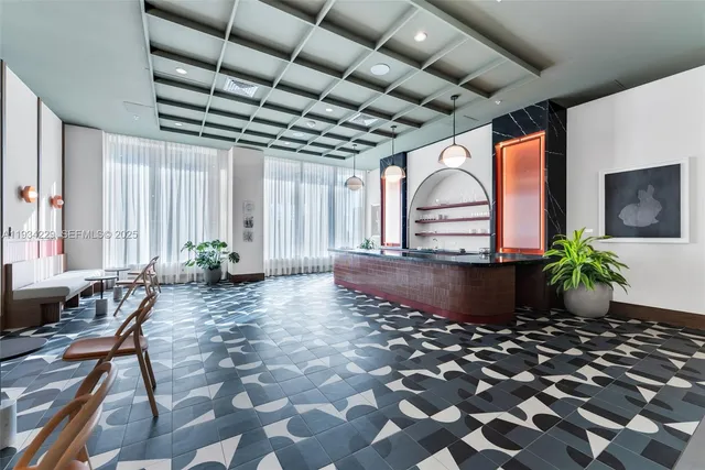 a view of swimming pool with lawn chairs with wooden floor