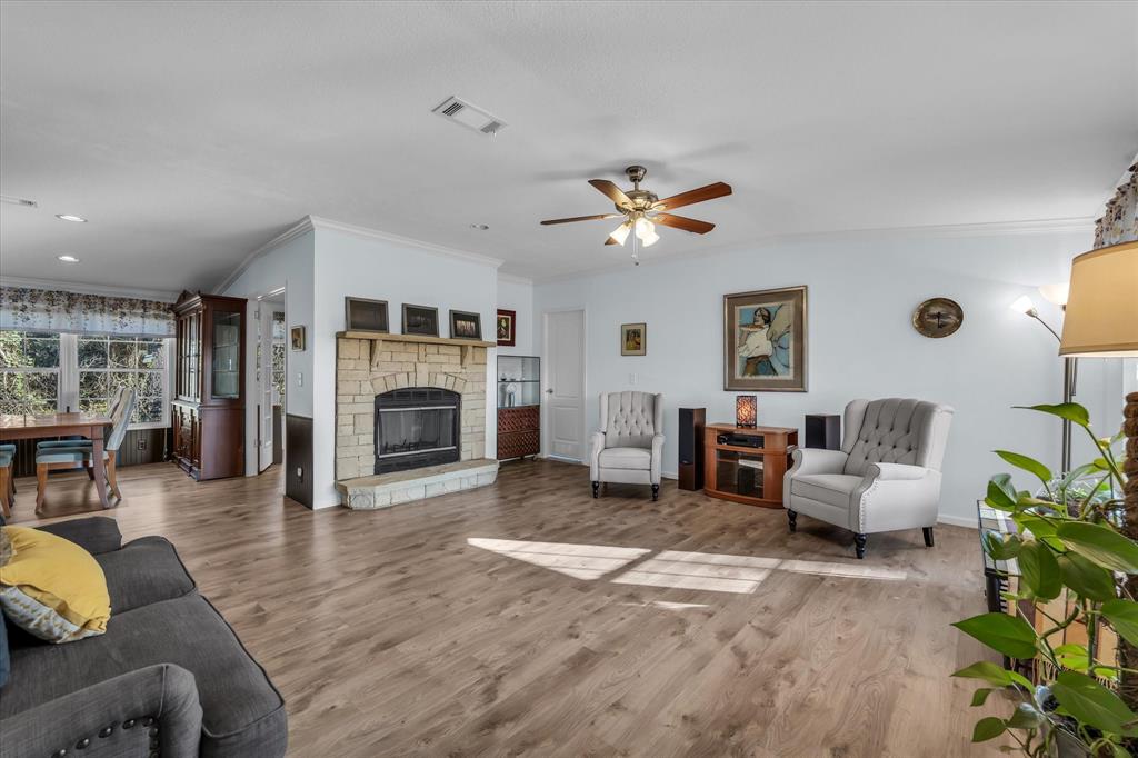 1745 Meixner Road Waco, TX 76705 - Photo 13 of 40 a living room with furniture and a fireplace